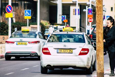 Tel Aviv Israel January 28, 2020 View of traditional Israeli taxi rolling in the streets of Tel Aviv in the afternoonのeditorial素材