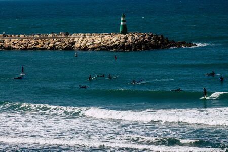 Tel Aviv Israel January 30, 2020 View of unidentified Israeli people having fun on the beach of Tel Aviv during a sunny day in winterの写真素材