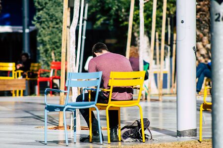 Tel Aviv Israel February 02, 2020 View of unidentified Israeli people sitting in the streets of Tel Aviv in winterの写真素材