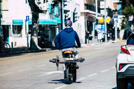 Tel Aviv Israel February 04, 2020 View of unidentified people rolling with a bicycle in the streets...