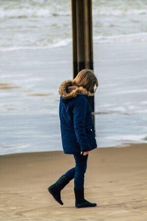 Tel Aviv Israel February 08, 2020 View of unidentified Israeli people having fun on the beach of Tel Aviv during a winter storm in the afternoonの写真素材