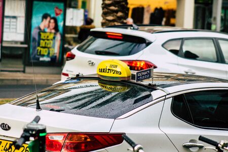 Tel Aviv Israel February 11, 2020 View of traditional Israeli taxi rolling in the streets of Tel Aviv in the afternoonの写真素材