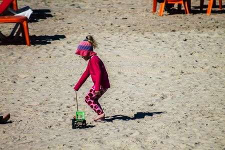 Tel Aviv Israel February 13, 2020 View of unidentified Israeli people having fun on the beach of Tel Aviv during a sunny day in winterの写真素材