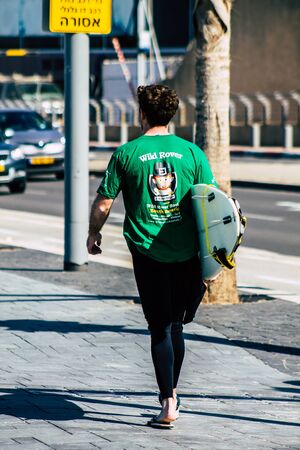 Tel Aviv Israel February 13, 2020 View of unidentified people walking on Herbert Samuel Promenade in Tel Aviv during a sunny day in winterの写真素材