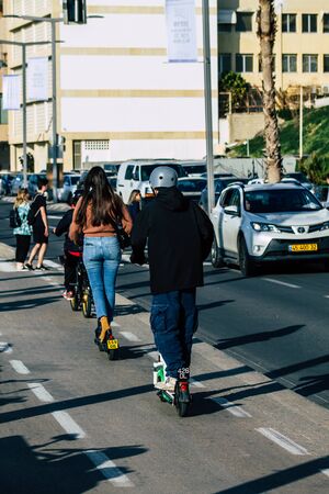 Tel Aviv Israel February 15, 2020 View of unidentified people rolling with an electric scooter in...
