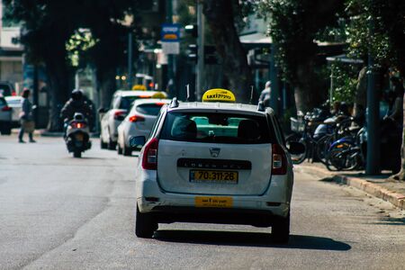 Tel Aviv Israel February 17, 2020 View of traditional Israeli taxi rolling in the streets of Tel Aviv in the afternoonの写真素材