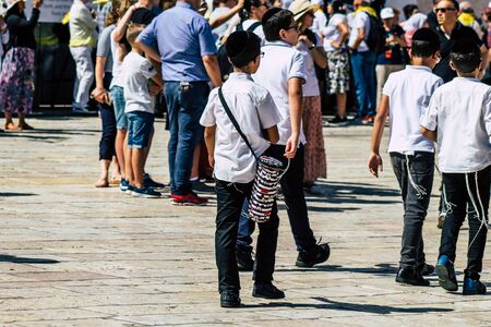 Jerusalem Israel October 06, 2019 View of unknowns Israeli young boy walking front the Western wall in the Old city of Jerusalem in the afternoonのeditorial素材