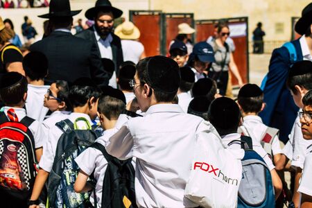 Jerusalem Israel October 06, 2019 View of unknowns Israeli young boy walking front the Western wall in the Old city of Jerusalem in the afternoonのeditorial素材