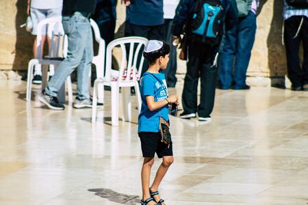 Jerusalem Israel October 06, 2019 View of unknowns Israeli young boy walking front the Western wall in the Old city of Jerusalem in the afternoonのeditorial素材