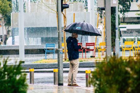 Tel Aviv Israel February 19, 2020 View of unidentified people walking in the streets of Tel Aviv during a raining day in winterのeditorial素材
