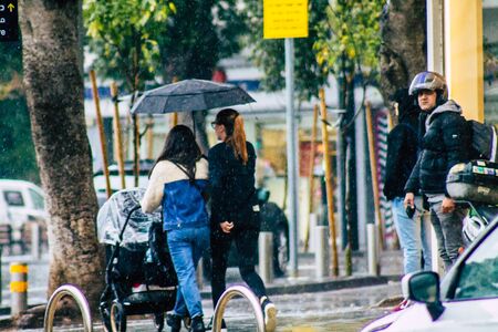 Tel Aviv Israel February 19, 2020 View of unidentified people walking in the streets of Tel Aviv during a raining day in winterのeditorial素材