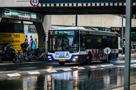 Tel Aviv Israel February 19, 2020 View of a traditional Israeli public city bus rolling in the streets of Tel Aviv during a raining day in winterのeditorial素材