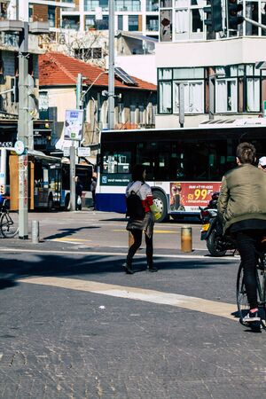 Tel Aviv Israel February 20, 2020 View of unidentified people walking in the streets of Tel Aviv during a sunny day in winterの写真素材