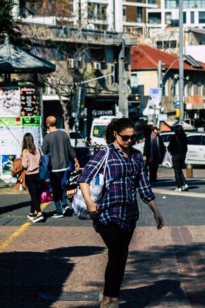 Tel Aviv Israel February 20, 2020 View of unidentified people walking in the streets of Tel Aviv during a sunny day in winterのeditorial素材