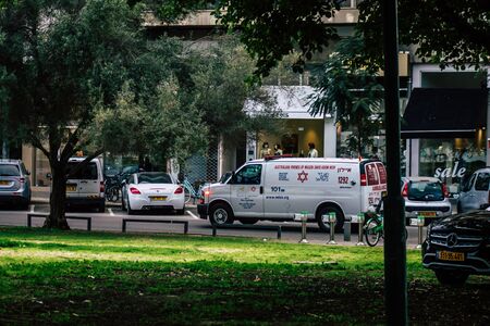 Tel Aviv Israel February 25, 2020 View of a Israeli ambulance rolling in the streets of Tel Aviv in the eveningの写真素材