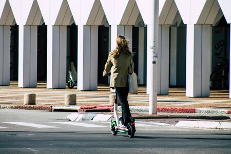 Tel Aviv Israel February 20, 2020 View of unidentified people rolling with an electric scooter in...