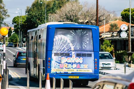 Paphos Cyprus February 29, 2020 View of a traditional public bus rolling in the streets of Paphos in the afternoonの写真素材