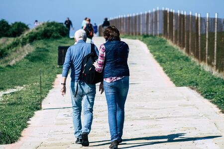 Paphos Cyprus March 01, 2020 View of unidentified people having fun on the beach of Paphos in the afternoonの写真素材