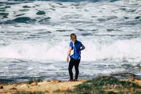 Paphos Cyprus March 01, 2020 View of unidentified people having fun on the beach of Paphos in the...