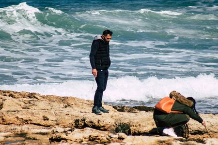 Paphos Cyprus March 01, 2020 View of unidentified people having fun on the beach of Paphos in the...