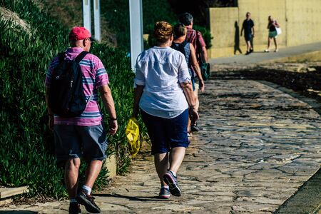 Paphos Cyprus March 10, 2020 View of unidentified tourist walking in the streets of Paphos in the...