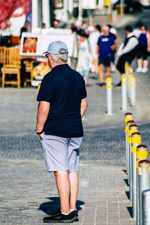 Paphos Cyprus March 10, 2020 View of unidentified tourist walking in the streets of Paphos in the...