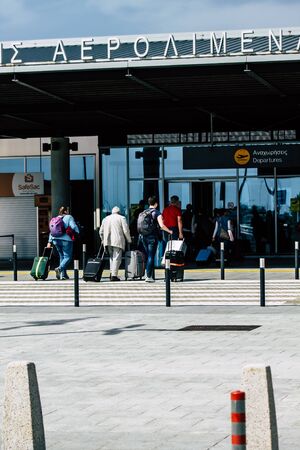Paphos Cyprus March 11, 2020 View of unidentified people going to the departure hall of Paphos international airport in the afternoonの写真素材