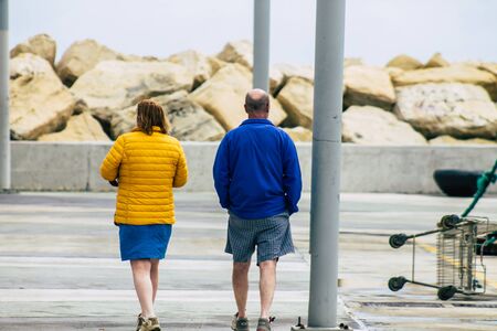 Limassol Cyprus March 13, 2020 View of unidentified tourist walking in the streets of Limassol in the afternoonの写真素材
