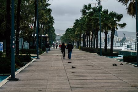 Limassol Cyprus March 13, 2020 View of unidentified tourist walking in the streets of Limassol in the afternoonの写真素材