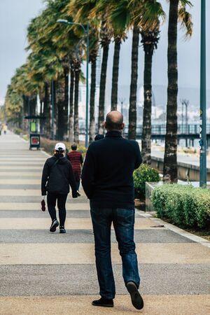 Limassol Cyprus March 13, 2020 View of unidentified tourist walking in the streets of Limassol in the afternoonの写真素材