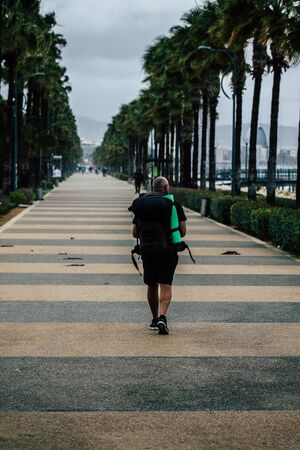 Limassol Cyprus March 13, 2020 View of unidentified tourist walking in the streets of Limassol in the afternoonの写真素材