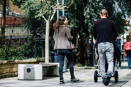 Limassol Cyprus March 13, 2020 View of unidentified tourist walking in the streets of Limassol in the afternoonの写真素材