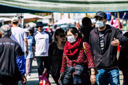 Limassol Cyprus March 14, 2020 View of an unidentified people with a face mask to protect themselves from the coronavirus shopping in the Limassol market in the morningのeditorial素材