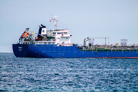 Limassol Cyprus March 20, 2020 View of a ship off the Cypriot coast facing the city of Limassol in the afternoonの写真素材
