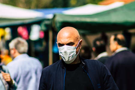 Limassol Cyprus March 14, 2020 View of an unidentified people with a face mask to protect themselves from the coronavirus shopping in the Limassol market in the morningのeditorial素材