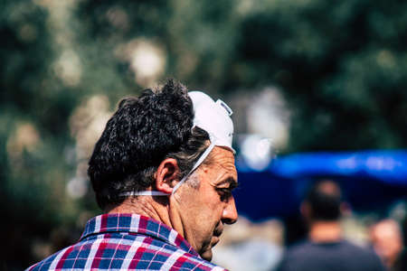 Limassol Cyprus March 14, 2020 View of an unidentified people with a face mask to protect themselves from the coronavirus shopping in the Limassol market in the morningのeditorial素材