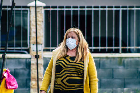 Limassol Cyprus March 14, 2020 View of an unidentified people with a face mask to protect themselves from the coronavirus shopping in the Limassol market in the morningのeditorial素材