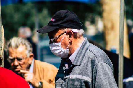 Limassol Cyprus March 14, 2020 View of an unidentified people with a face mask to protect themselves from the coronavirus shopping in the Limassol market in the morningのeditorial素材