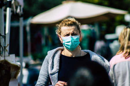 Limassol Cyprus March 14, 2020 View of an unidentified people with a face mask to protect themselves from the coronavirus shopping in the Limassol market in the morningのeditorial素材