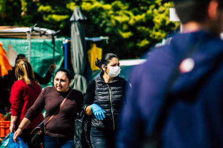 Limassol Cyprus March 14, 2020 View of an unidentified people with a face mask to protect themselves from the coronavirus shopping in the Limassol market in the morningのeditorial素材