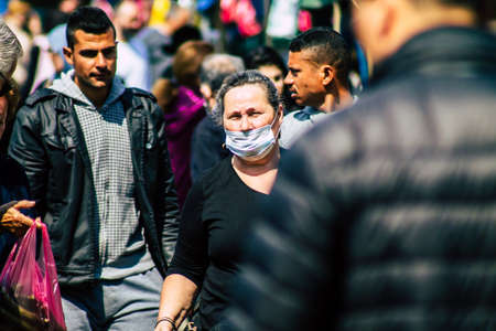 Limassol Cyprus March 14, 2020 View of an unidentified people with a face mask to protect themselves from the coronavirus shopping in the Limassol market in the morningのeditorial素材