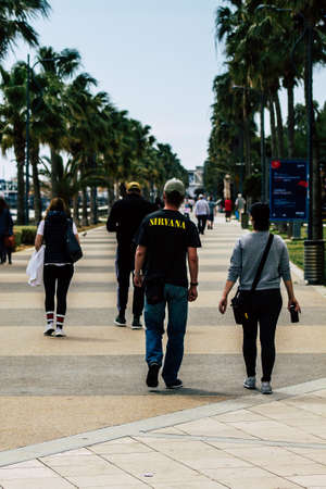 Limassol Cyprus March 16, 2020 View of an unidentified people without a face mask to protect themselves from the coronavirus walking in the street of Limassol in the afternoonのeditorial素材