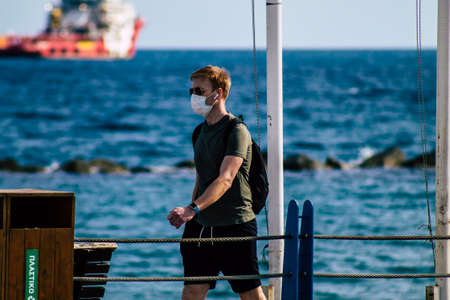 Limassol Cyprus March 16, 2020 View of an unidentified people with a face mask to protect themselves...