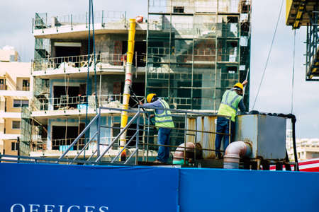 Limassol Cyprus March 16, 2020 View of unidentified people working to a new building in construction...
