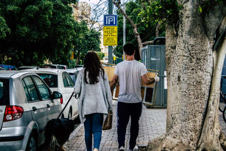 Tel Aviv Israel March 31, 2020 View of unidentified people walking in the empty streets of Tel Aviv during the quarantine of the population to prevent the spread of coronavirusのeditorial素材