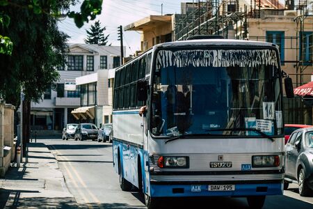Limassol Cyprus April 07, 2020 View of a traditional public bus rolling in the streets of Limassol in the afternoonの写真素材