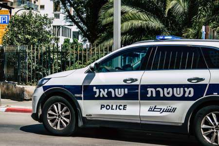 Tel Aviv Israel April 12, 2020 View of a Israeli police car rolling in the streets of Tel Aviv during the quarantine of the population to prevent the spread of the coronavirusのeditorial素材