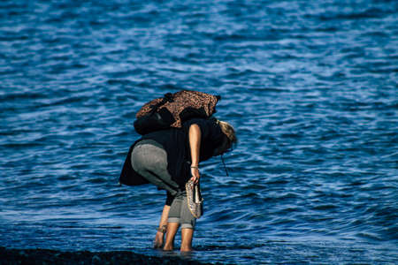 Limassol Cyprus May 05, 2020 View of unidentified young woman having fun on the beach of Limassol in the afternoon during the coronavirus outbreakのeditorial素材