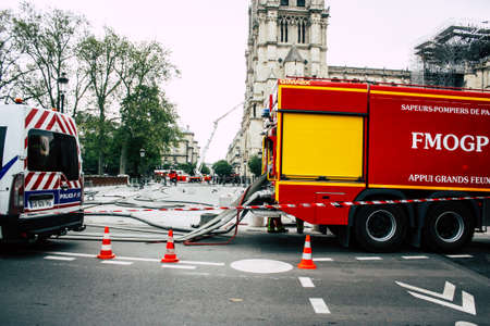 Paris France April 16, 2019 View of a fire truck parked near the Notre Dame cathedral in Paris the day after the big fire in the afternoonのeditorial素材