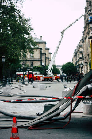 Paris France April 16, 2019 View of a fire truck parked near the Notre Dame cathedral in Paris the day after the big fire in the afternoonのeditorial素材